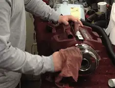 Vacuum repair technician cleaning and servicing a vacuum motor in Philadelphia, PA
